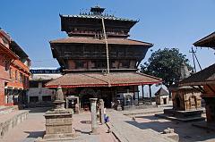 Kathmandu 09-2 Kirtipur Bagh Bhairav Temple Full View On the saddle between the two Kirtipur hills south of Kathmandu is the three-storied Bagh Bhairav Temple, built between 1099 and 1126. The temple is dedicated to Shiva the Destroyer (Bhairav) in the form of a tiger (bahg). The temple is covered with swords and shields that belong to the troop of Kirtipur, who were defeat by the army of King Prithvi Narayan Shah.